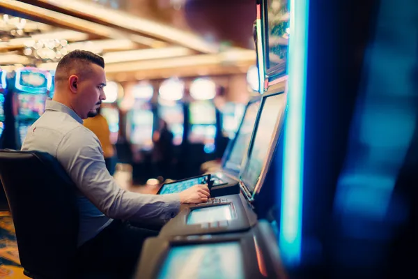 A young woman relaxing with her phone while dynamic casino elements float around her, illustrating the smooth mobile experience offered by the 1333BET app.