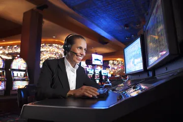 A cheerful woman in traditional clothing using her smartphone during a festive moment, showing how easily the 1333BET app fits into everyday life.