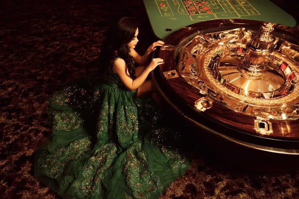 A glamorous woman holding casino chips in a neon-lit environment, representing the premium online casino atmosphere of 1333BET.